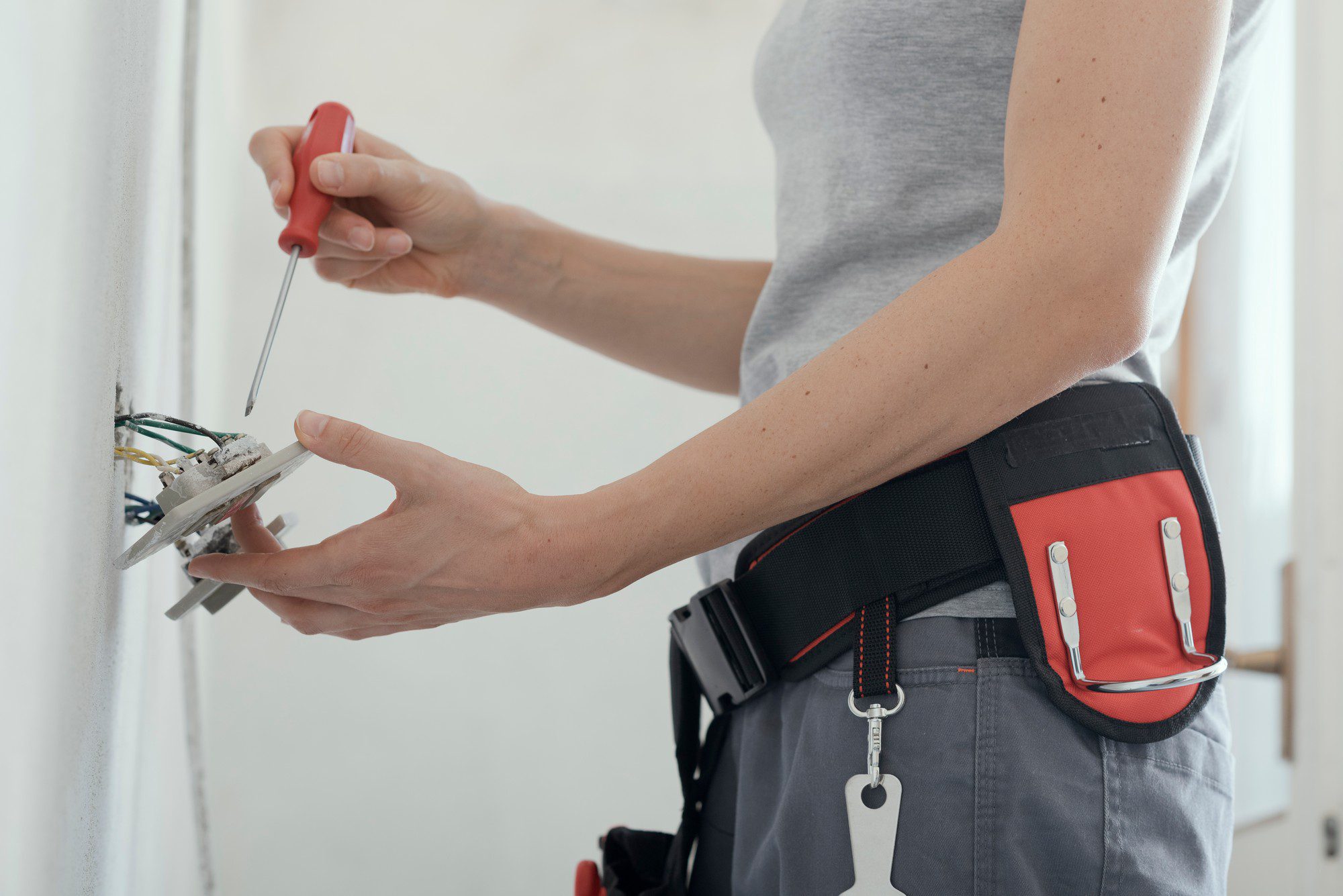 Female Electrician Fixing A Socket At Home 2021 08 26 22 39 57 Utc